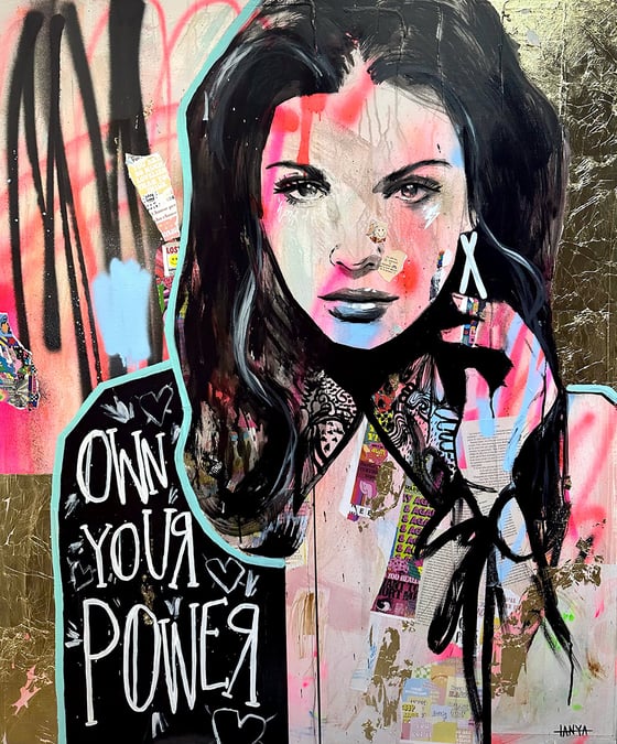 a woman in pink and black over gold leaf, with the words Own Your Power